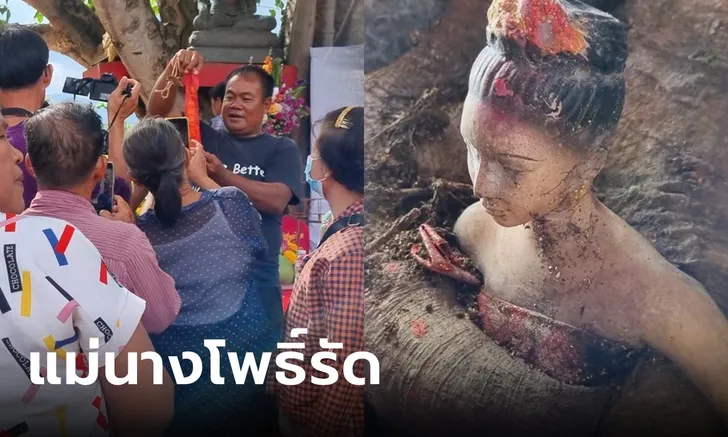 รูปปั้นหญิงสาวโผล่กลางโคนต้นโพธิ์ - showlek